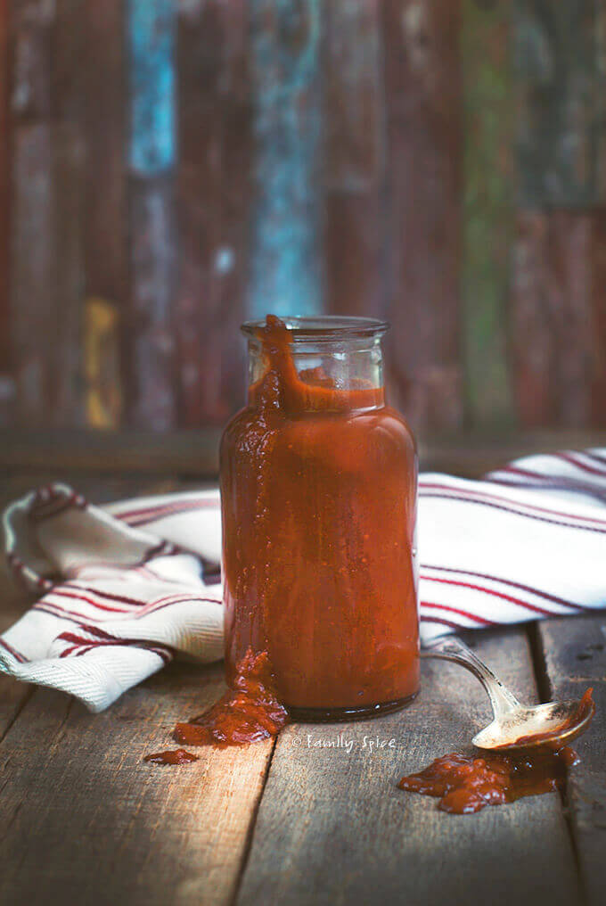 A bottle of homemade honey whiskey barbecue sauce by FamilySpice.com