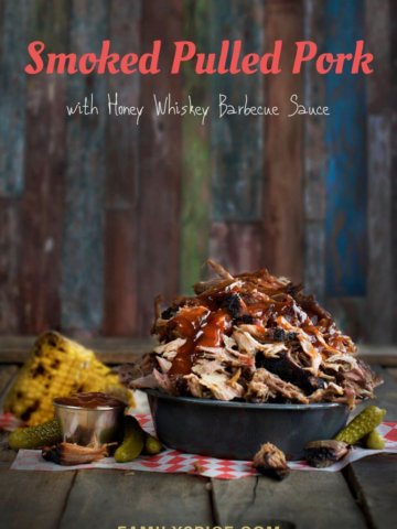 A pile of smoked pulled pork topped with honey whiskey barbecue sauce by FamilySpice.com