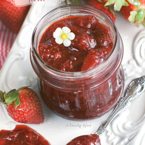 Overhead shot of A jar full of strawberry balsamic jam by FamilySpice.com