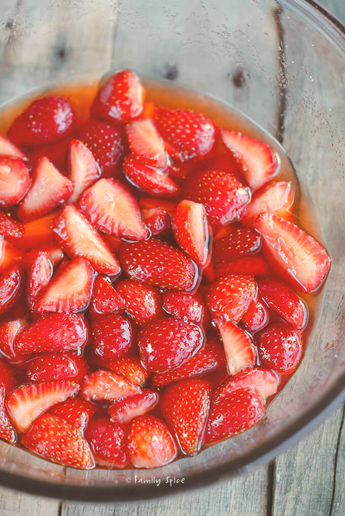 A bowl full of macerated strawberries by FamilySpice.com