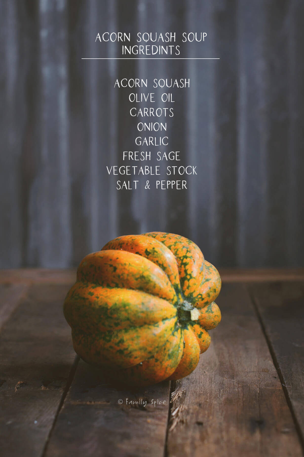 Image of acorn squash on rustic background with ingredients to make acorn squash soup listed