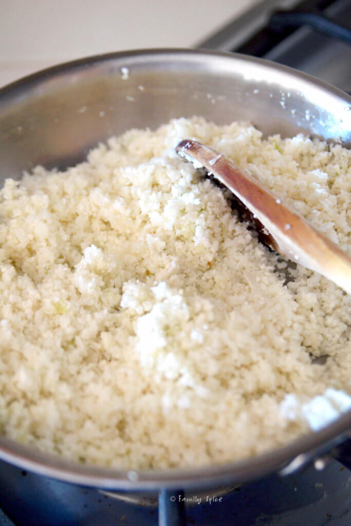 Cooking cauliflower rice in a small stainless pot