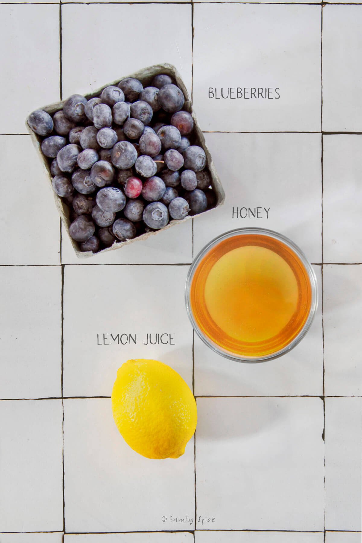 Ingredients labeled and needed to make blueberry honey jam