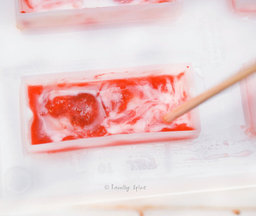 Making strawberry rhubarb creamsicle popsicles in the popsicle mold