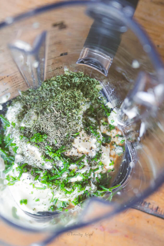 Top view of a blender with ingredients to make homemade ranch dressing