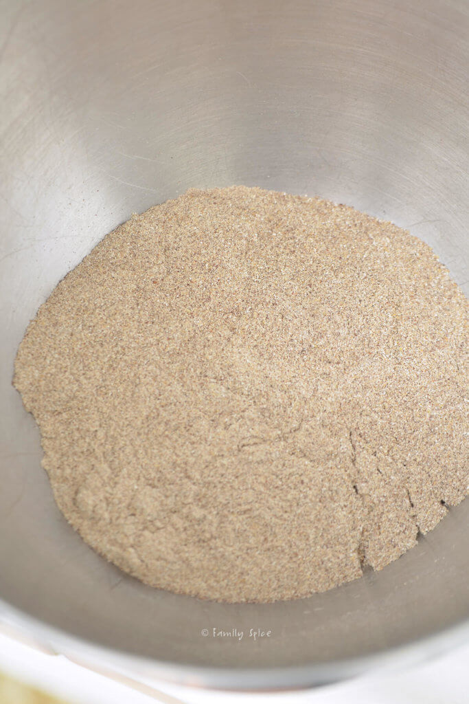 Freshly ground quinoa flour in a metal bowl