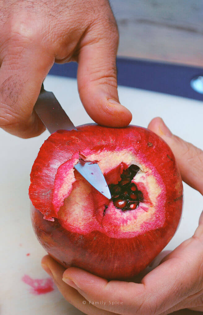 Peeling the skin off the pomegranate by FamilySpice.com