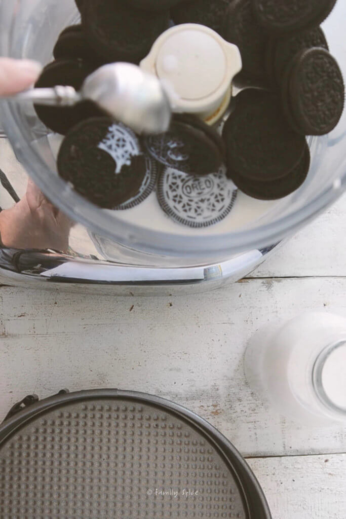 Top view of Oreos and milk in a food processor