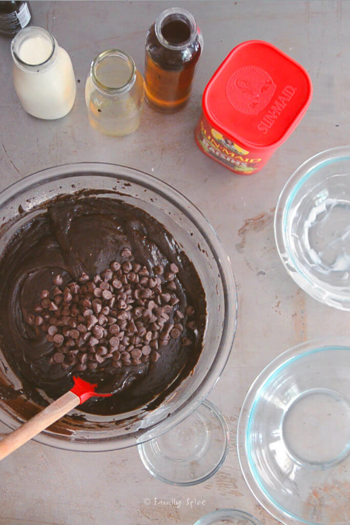 Mixing in chocolate chips into chocolate cake batter