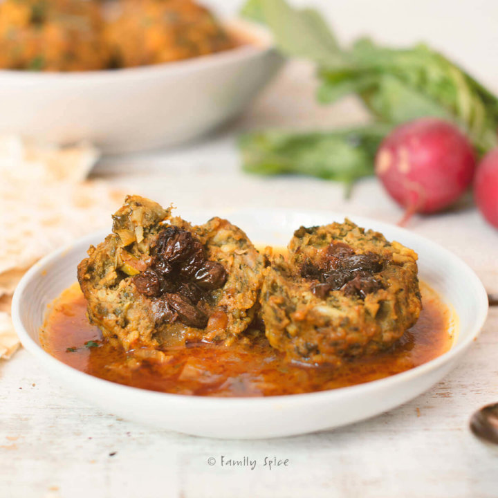 Koofteh Berenji are Persian meatballs that are tender and mixed with an assortment of fresh herbs and rice, stuffed with raisins, and simmered in a simple tomato broth. -- FamilySpice.com
