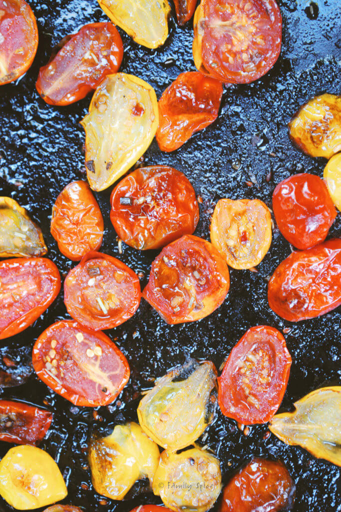 Roasted cherry tomatoes on a baking sheet