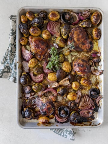 Top view of sheet pan balsamic chicken with vegetables.
