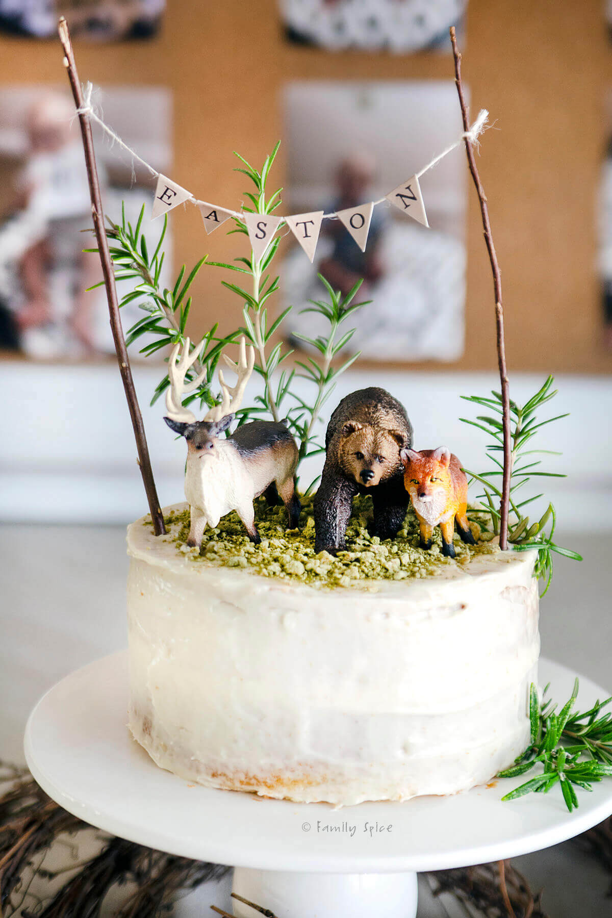 Closeup of a woodlands cake decorated and on a white pedestal