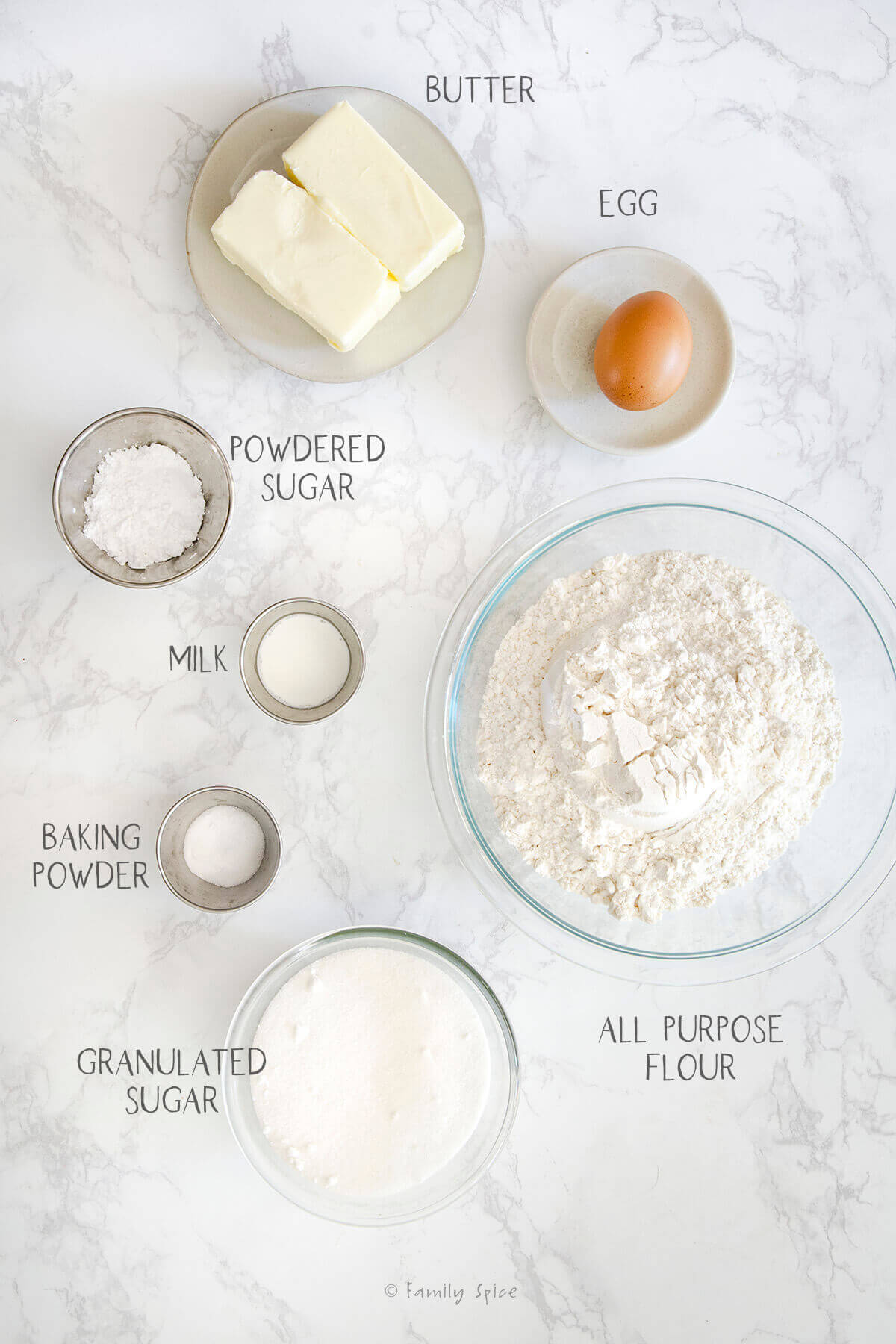 Ingredients labeled and needed to make sugar cookies