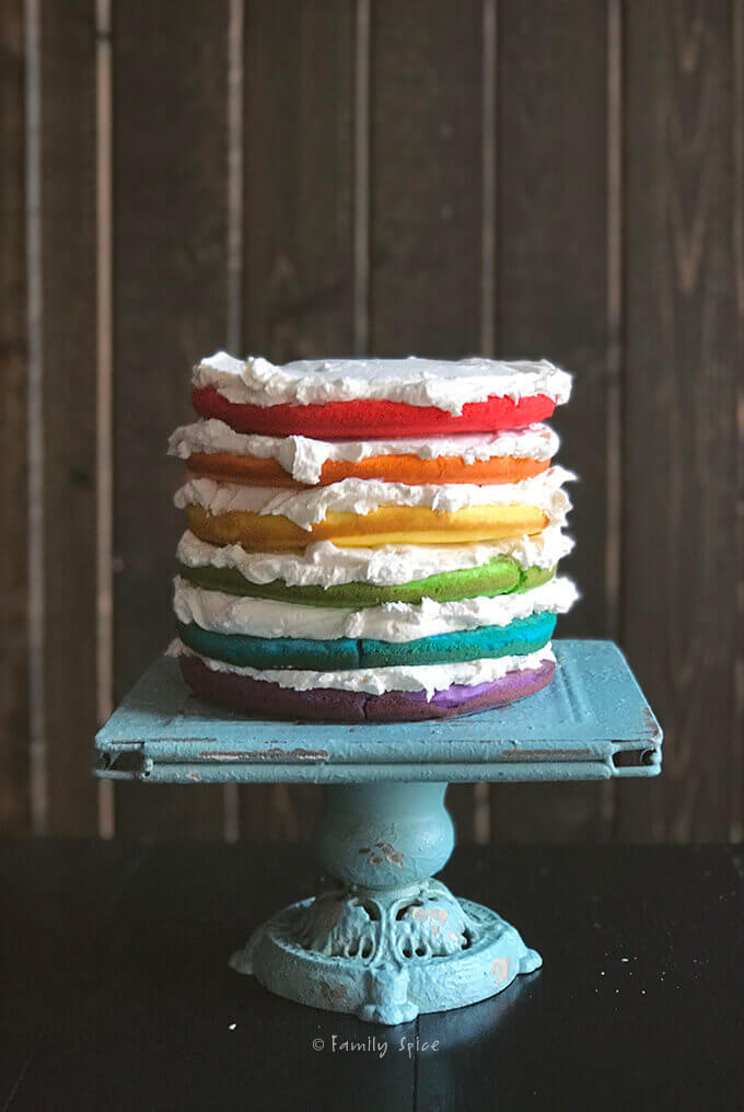Six rainbow layers make up the base of the unicorn cake by FamilySpice.com