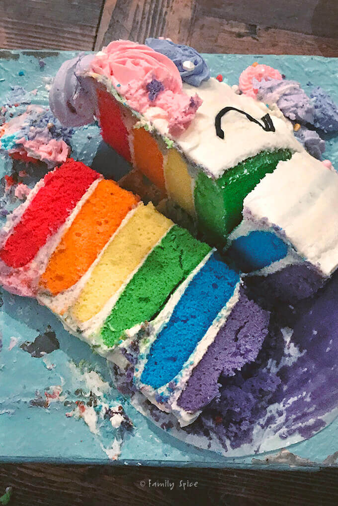 What's left of my rainbow layered unicorn cake by FamilySpice.com
