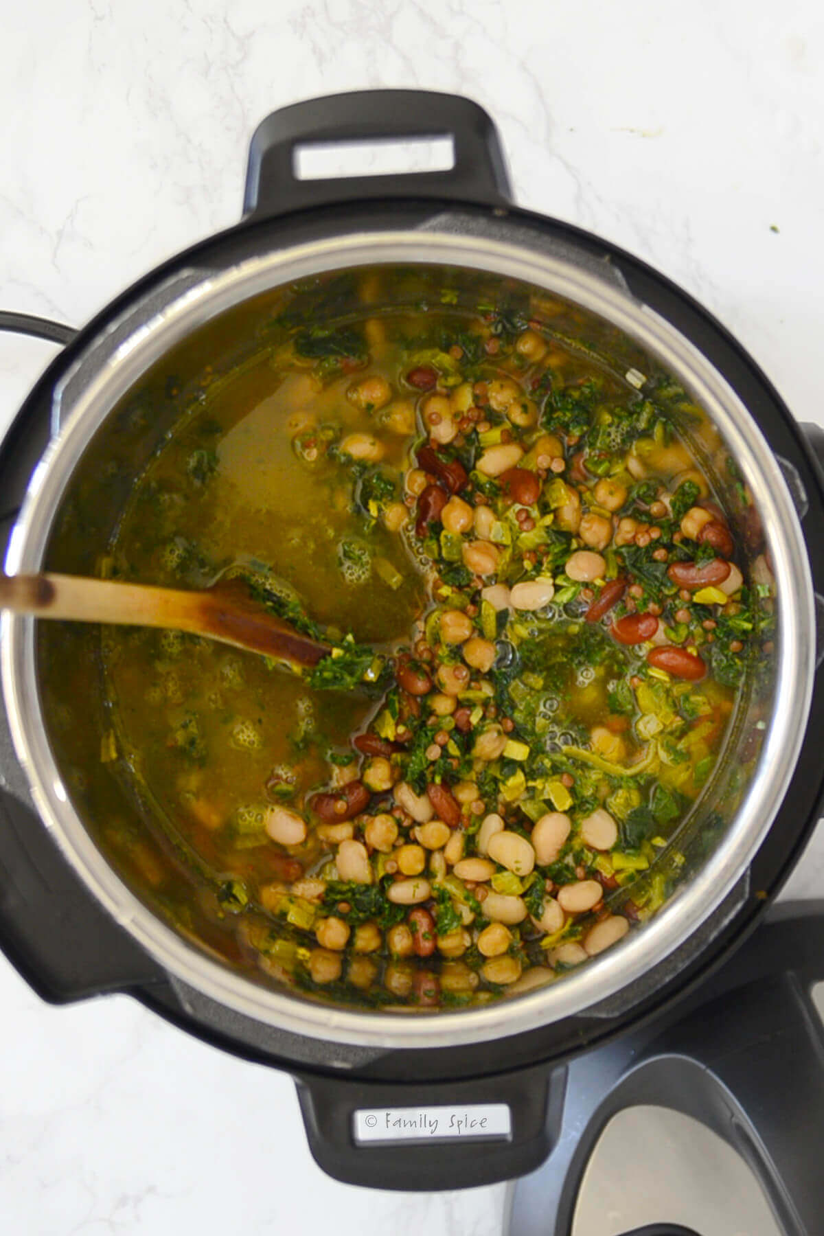 Vegetable broth added to ash reshteh in the instant pot