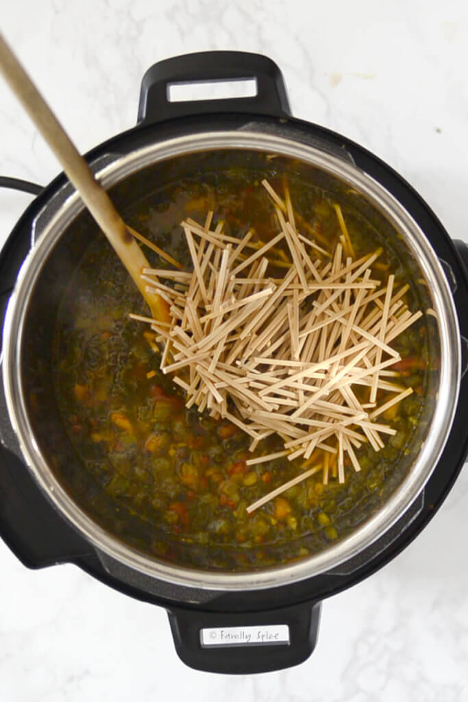 Adding noodles rest of ash reshteh in the instant pot