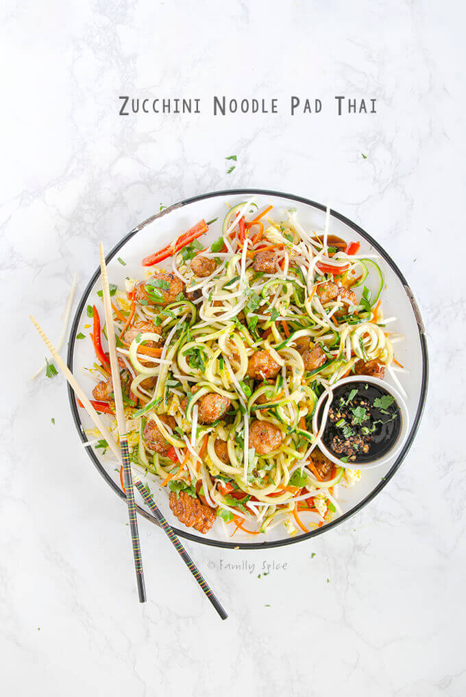 Overhead shot of a plate full of Zucchini Noodle Pad Thai with Orange Chicken by FamilySpice.com