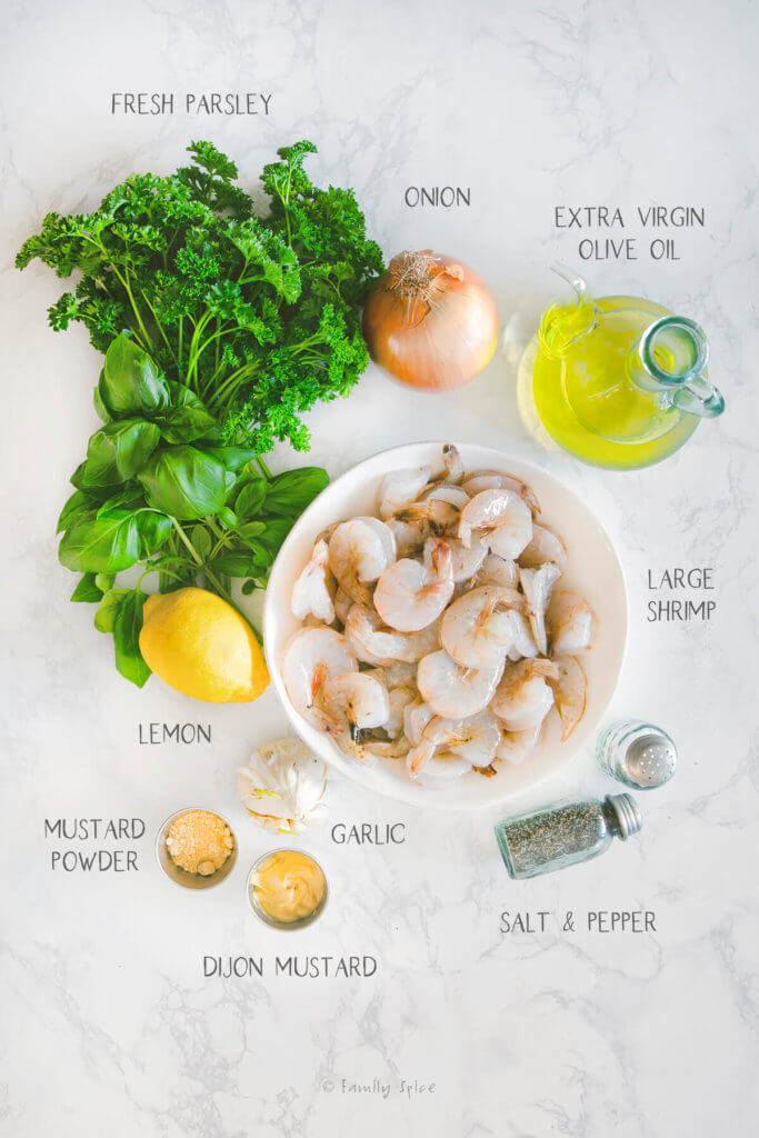 Ingredients labeled and needed to make grilled shrimp kabobs