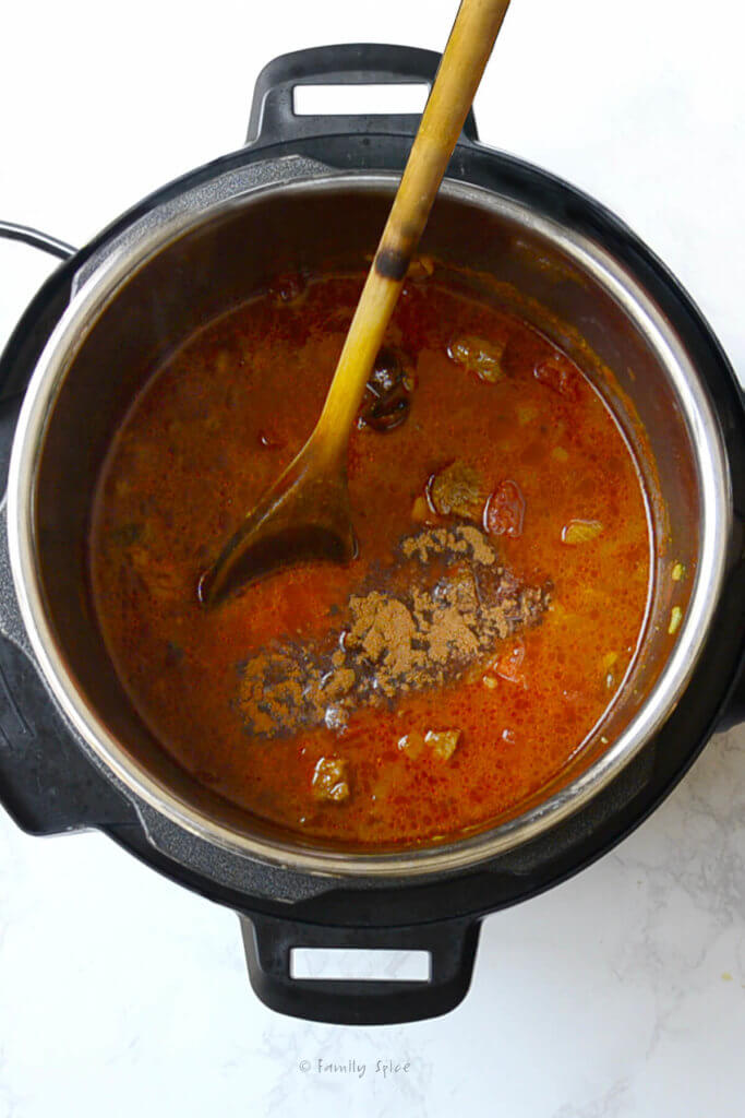 Adding seasonings to tomato base of khoresh gheymeh in instant pot