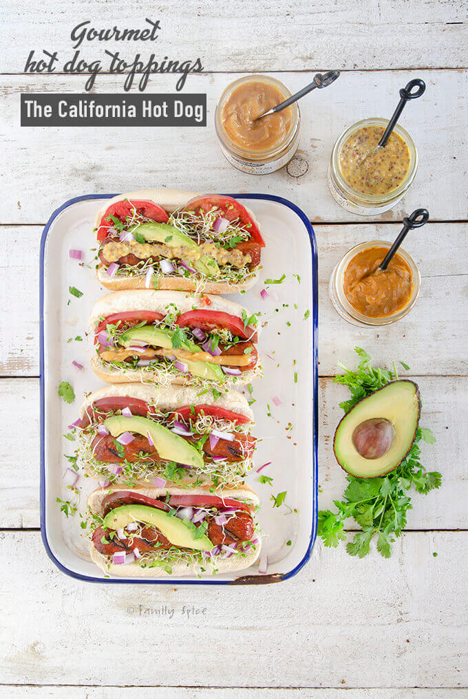 Gourmet hot dog toppings like avocado, tomato, sprouts, cilantro and red onions for the California Hot Dog 