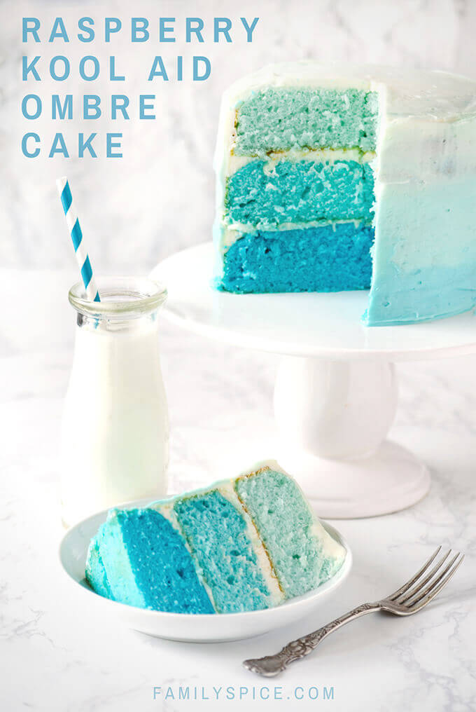 Frosted blue raspberry kool aid ombre cake with a slice cut out and a bottle of milk by FamilySpice.com