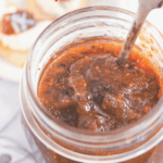 Closeup view of an open jar of cinnamon fig jam by FamilySpice.com