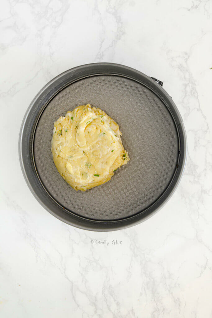 Olive oil pie crust dough in a springform pan