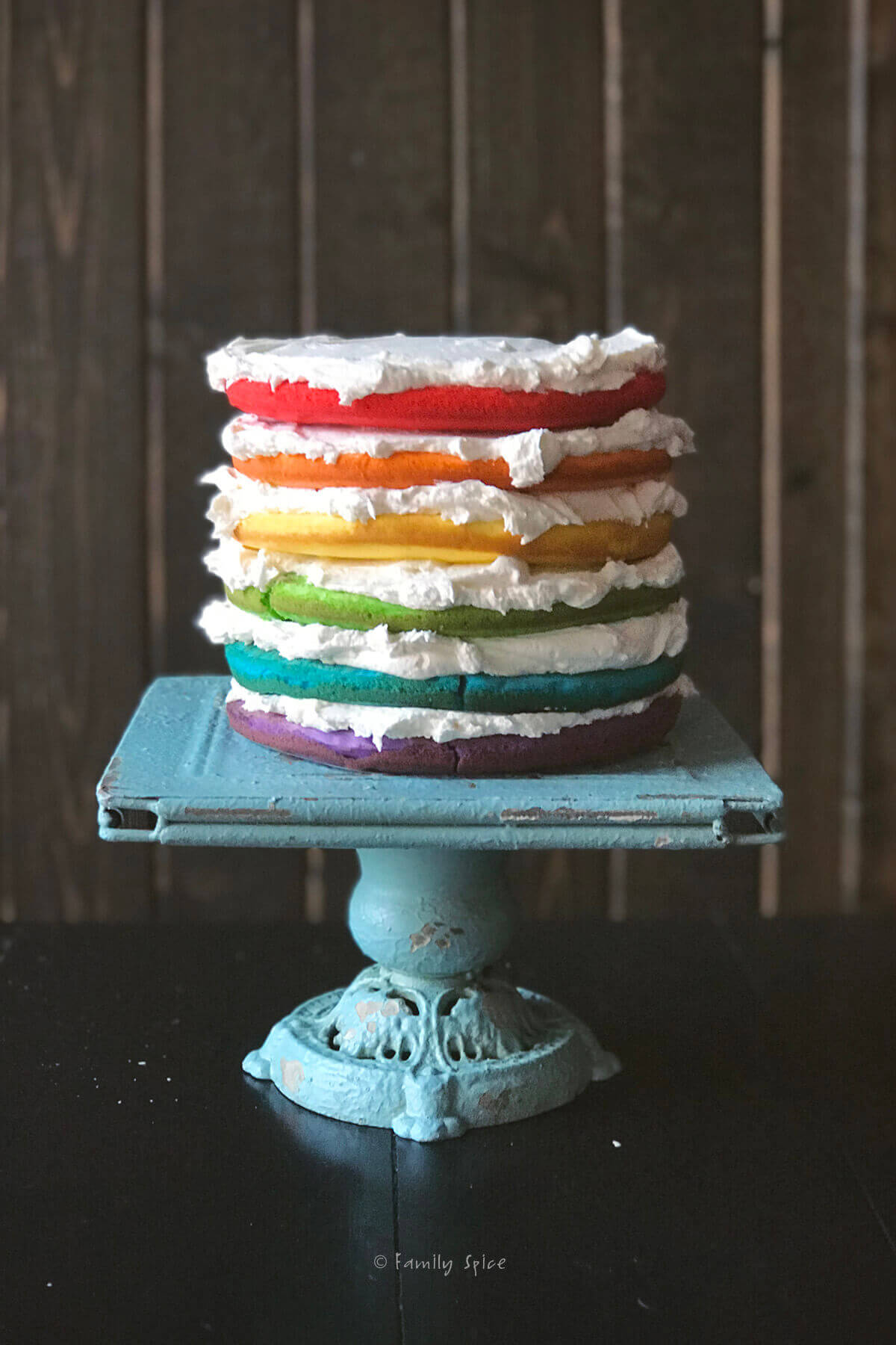 Six rainbow layers make up the base of the unicorn cake
