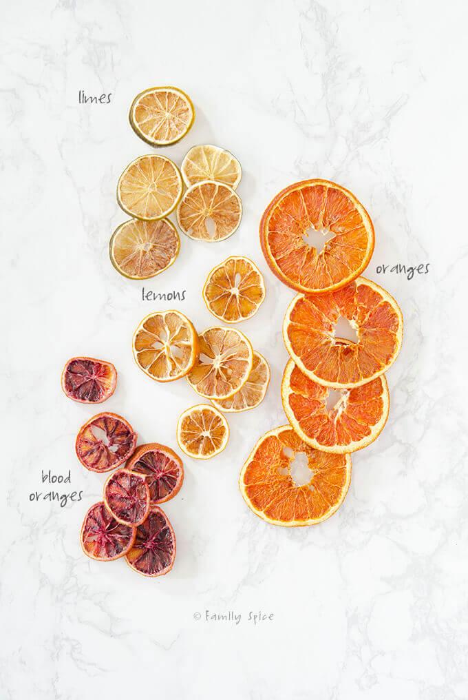 Overhead shot of assorted dried citrus like orange, lemon, lime and blood orange by FamilySpice.com