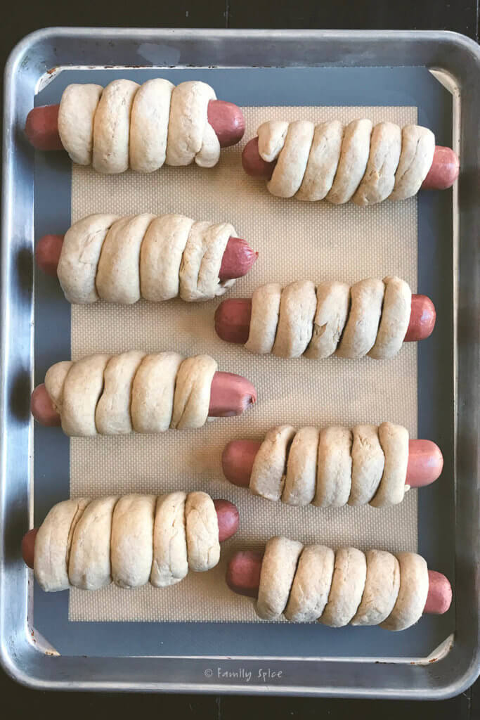 Whole wheat pretzel dough wrapped around hot dogs