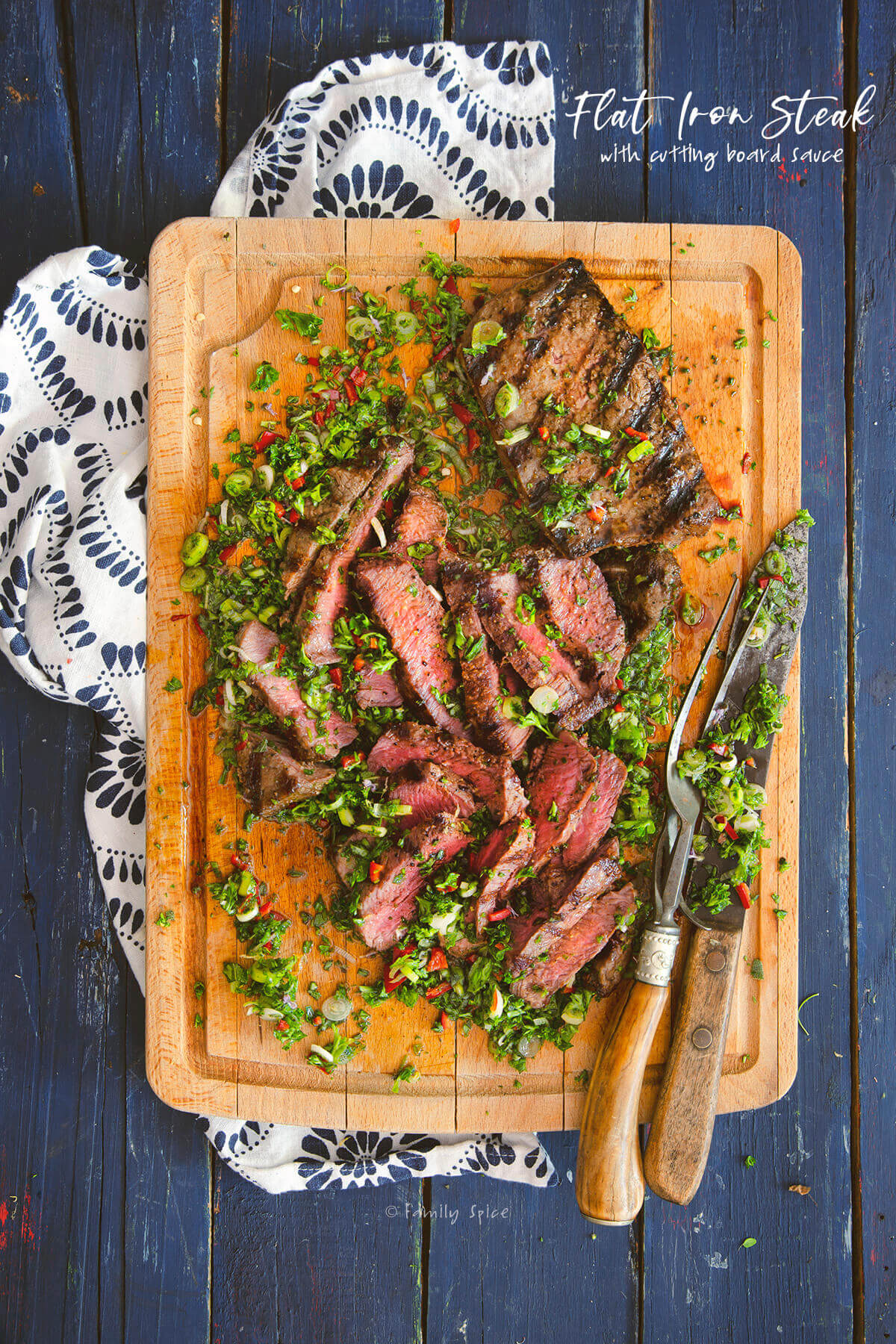 https://familyspice.com/wp-content/uploads/2020/07/flat-iron-steak-cutting-board-sauce3-1200.jpg