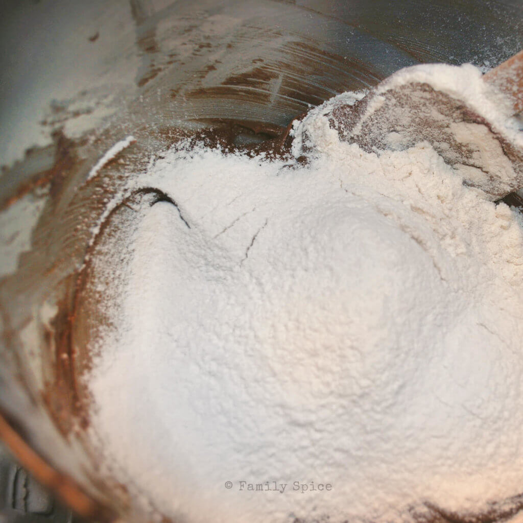 Adding flour mixture to remainder of brownie batter in bowl