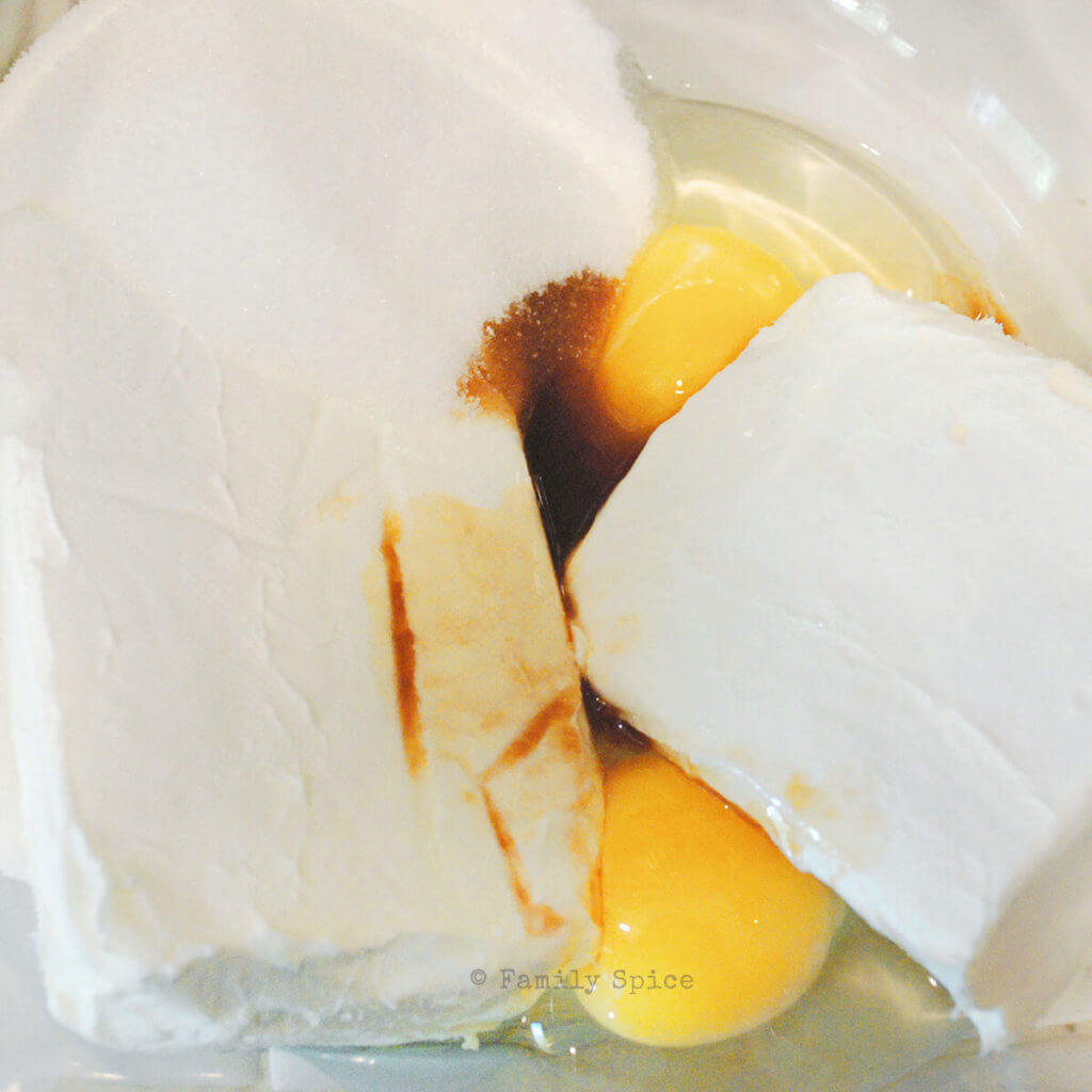 Mixing up cream cheese, sugar, eggs and vanilla in a bowl