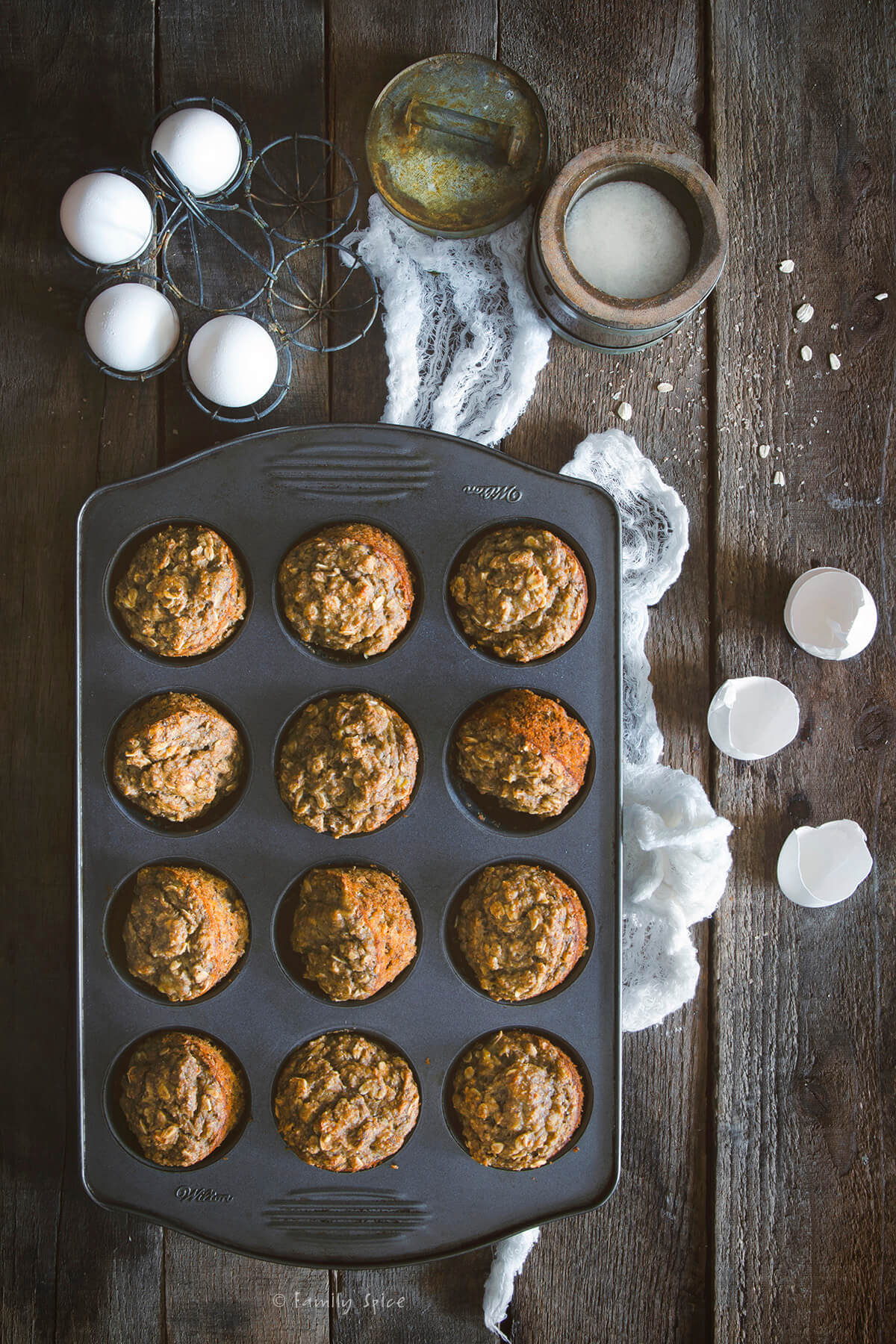 Freshly baked oatmeal muffins in a muffin pan
