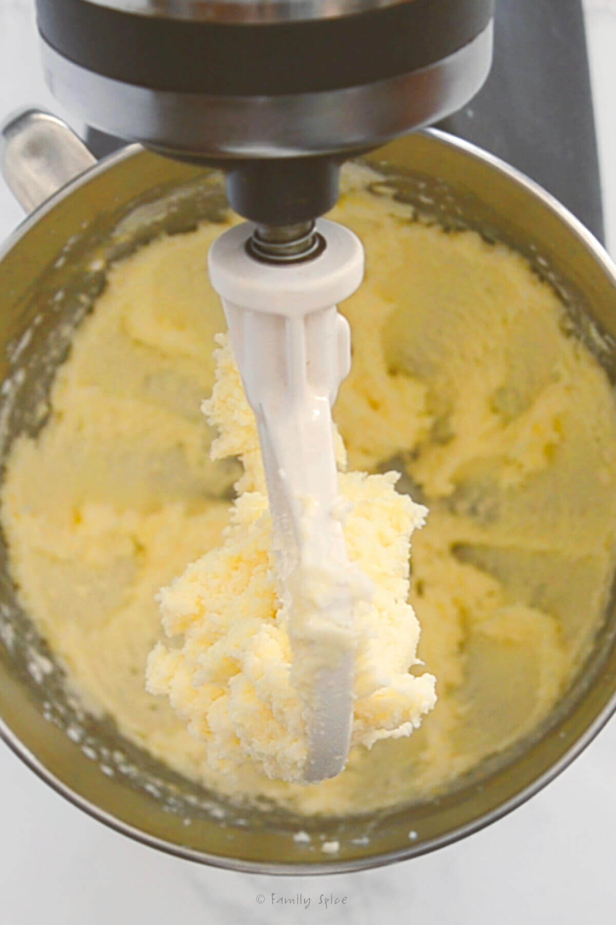 Closeup of sugar cookie dough in a mixer