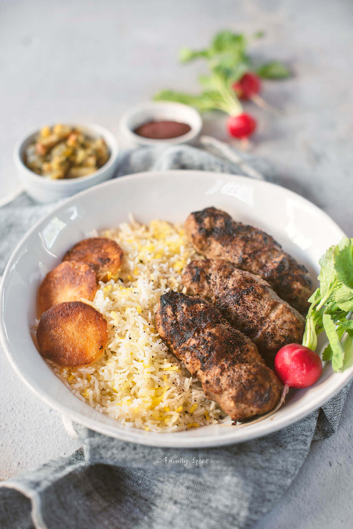 Persian koobideh kebab made in the air fryer over basmati rice with potato tadig and radishes
