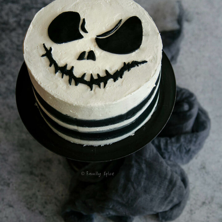 Top view of a nightmare before christmas cake on a black pedestal