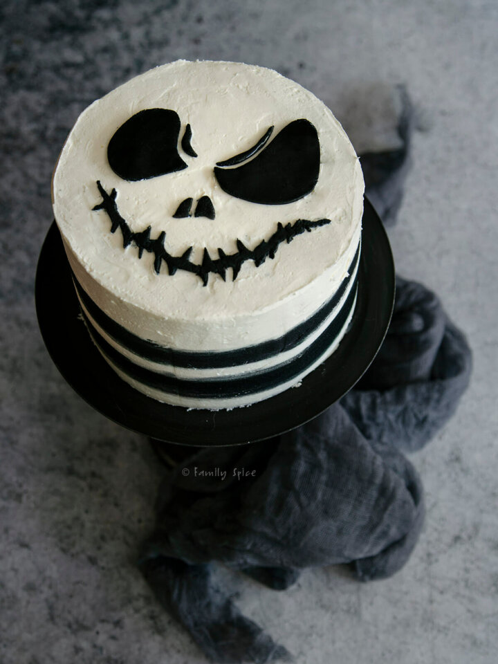 Top view of a nightmare before christmas cake on a black pedestal