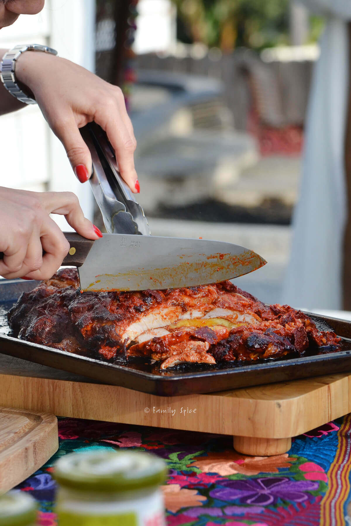 Closeup of slicing a freshly roasted pork adobada