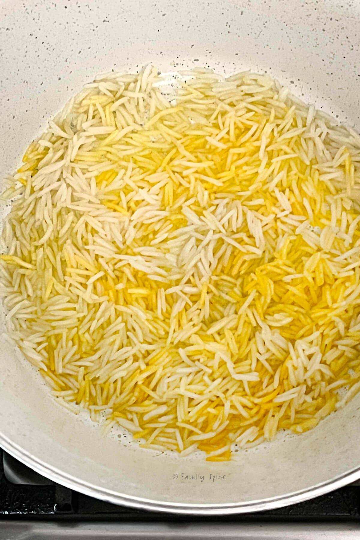 Basmati rice with saffron pressed in melted butter on the bottom of a pot