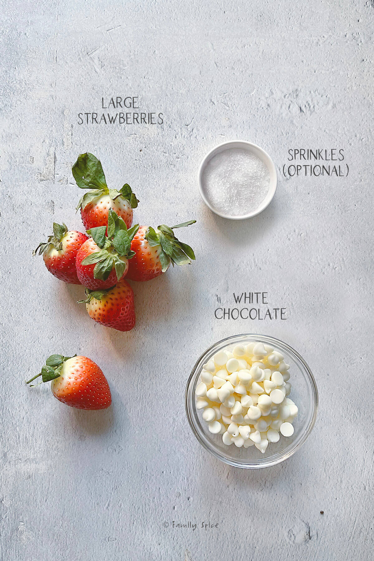Ingredients labeled and needed to make white chocolate strawberries