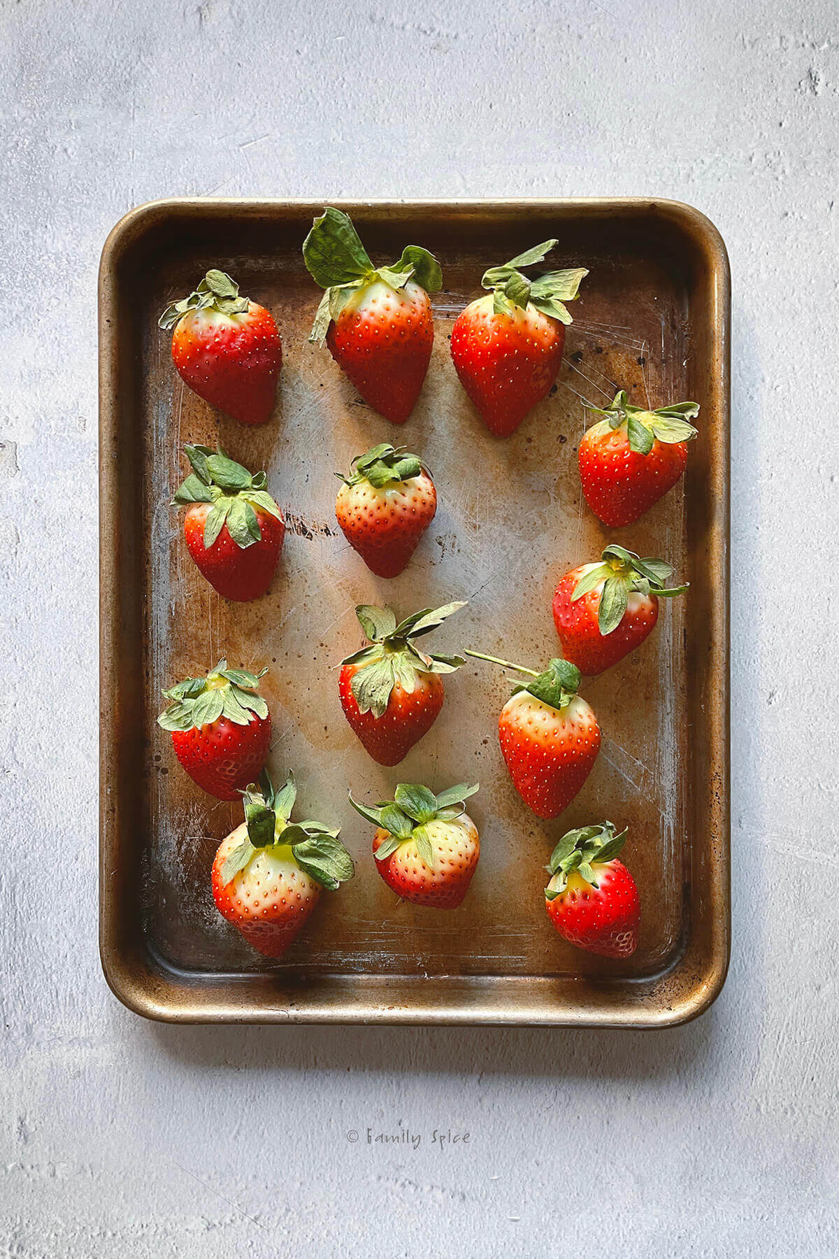 Large strawberries on small baking sheet