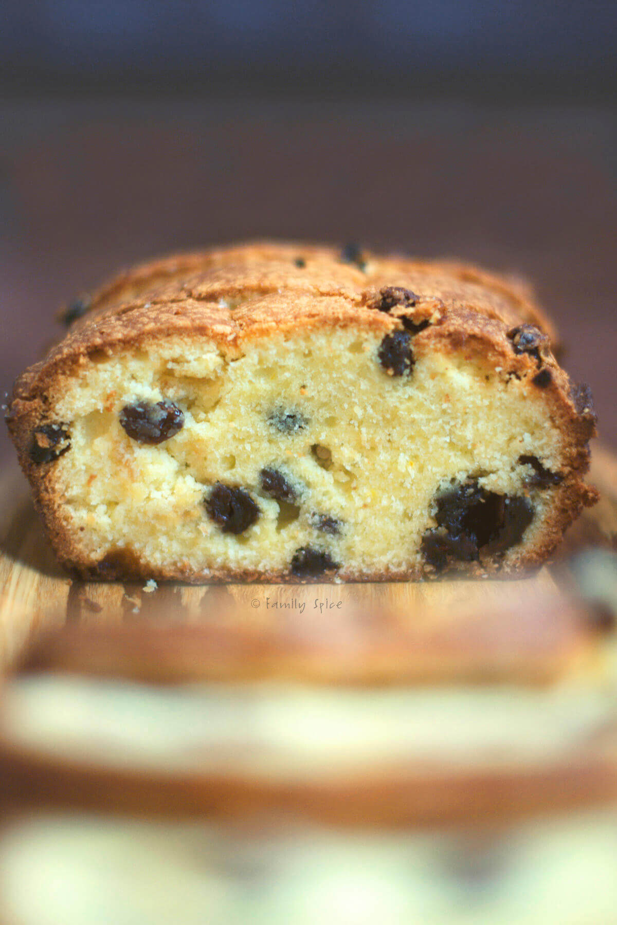Side view of saffron cake with raisins sliced open