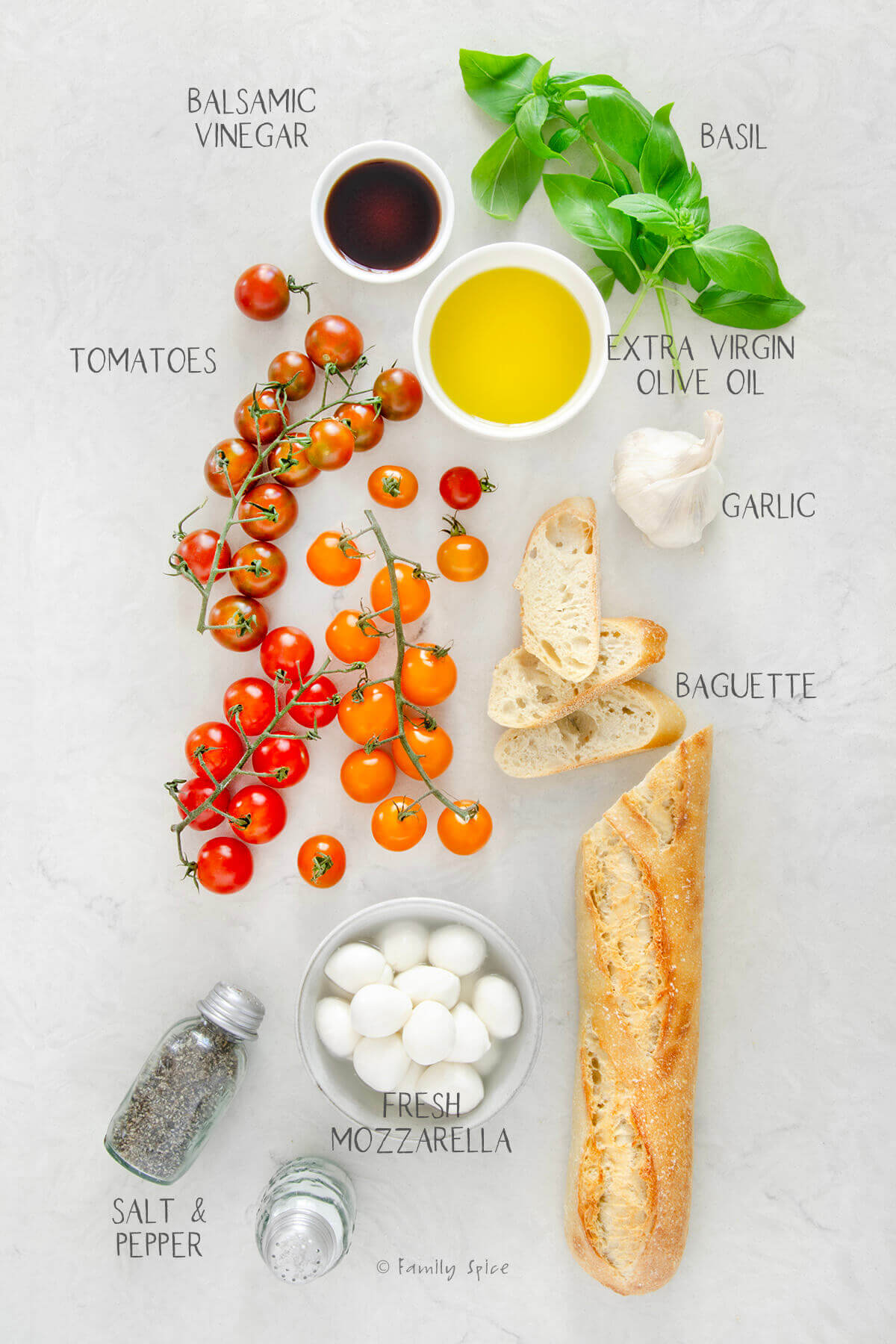 Ingredients labeled and needed to make bruschetta mozzarella