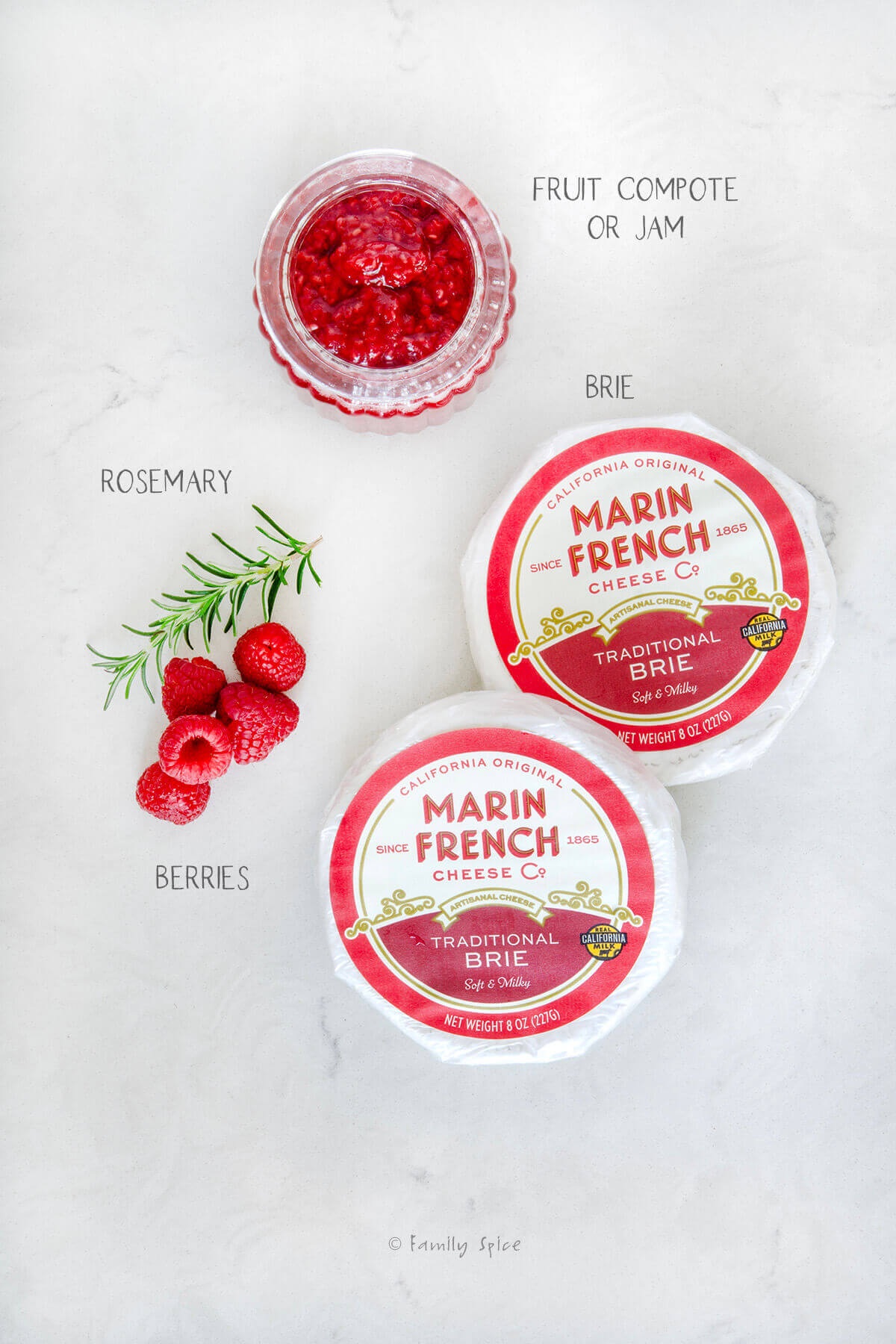 Ingredients labeled and needed to make whipped brie with raspberry compote