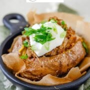 Pinterest image for pulled pork baked potatoes.